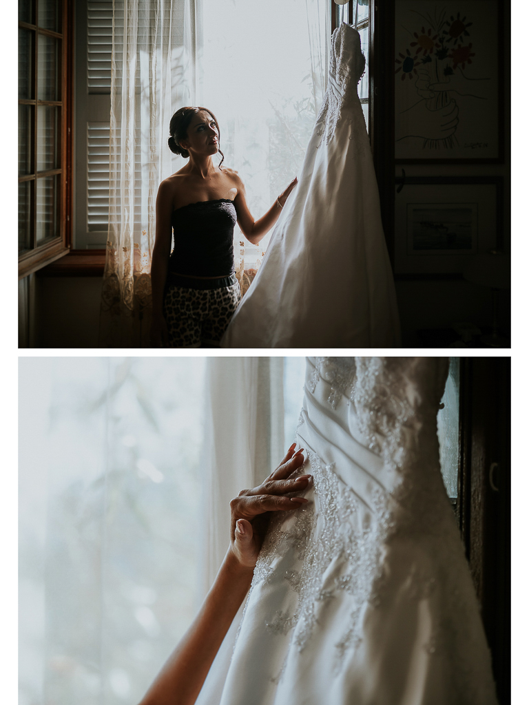 la sposa osserva il suo abito bianco